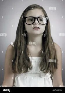 Portrait of a girl wearing glasses Stock Photohttps. shopping_cart. 