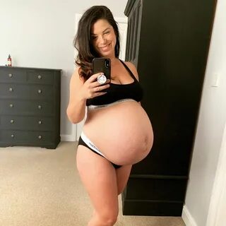 huge pregnant belly. sexy pregnant woman. 