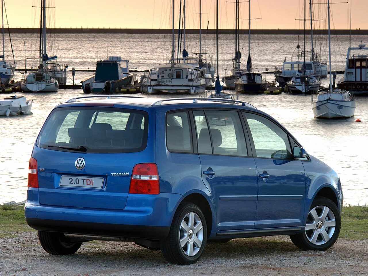 Volkswagen touran i 2003-2010. Volkswagen touran 1 поколение. Фольксваген туран 2003. 4. Touran 2006.