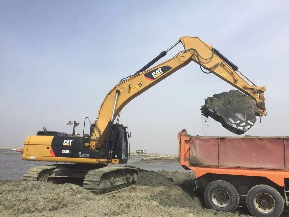 Cat 329dl. Caterpillar 329dl. Экскаватор Cat 329. Аккумулятор экскаватор Cat 329dl.