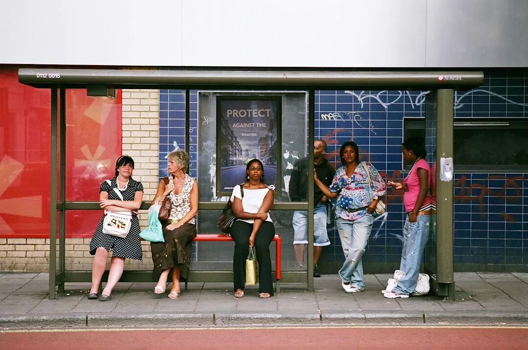 Where the bus stop. At the bus stop. people at the bus stop. люди на остановке. фото wait for a bus.