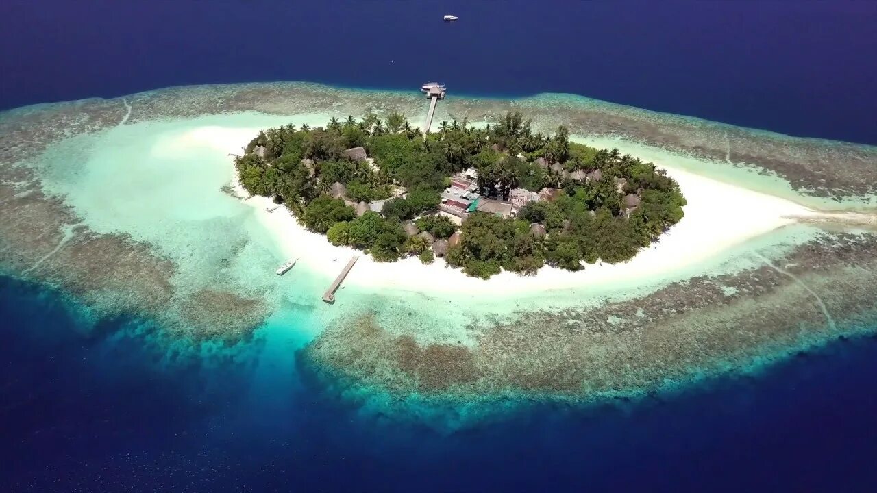 Кудахувадху Мальдивы остров. Kurumba Maldives 5 Мальдивы. Мальдивы с воздуха. Fihalhohi с высоты. Fun island