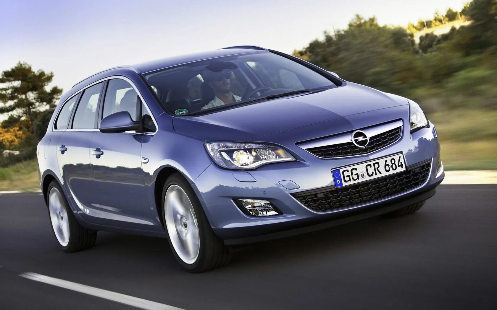 Gm купить опель. Opel Astra j 2009. Opel Astra j 2010. Opel Astra j Sports Tourer 2010.