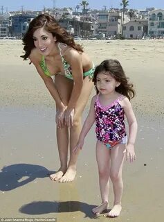 Farrah Abraham slips into a revealing bikini to play doting mother to daugh...