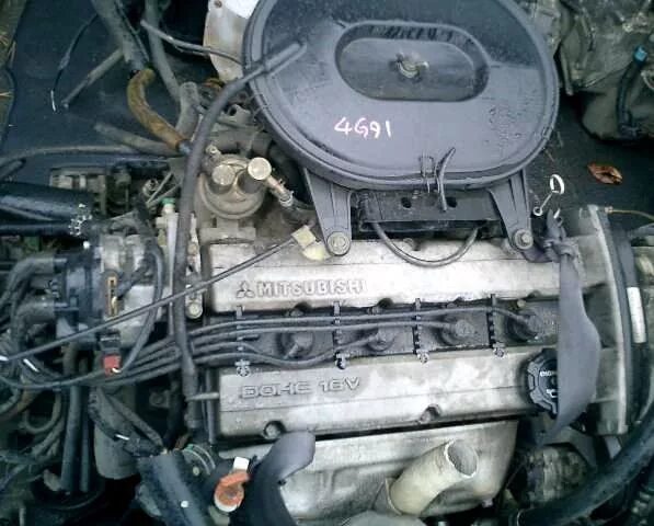 Двигатель джи 15. Двигатель 4g91 mitsubishi. lancer 4g91. митсубиси 4g91 карбюратор. двигатель 4g91 инжектор.