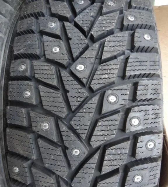 Данлоп сп айс. Dunlop SP Winter Ice 02. Dunlop Winter Ice o3. Winter Ice 225/55/17. Лучшие шипованные шины 2020.