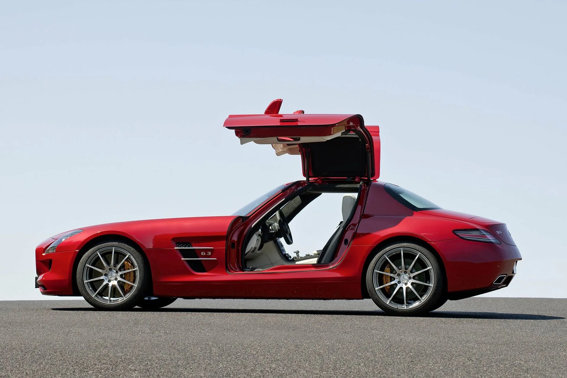 Автомобиль s. Мерседес СЛС купе. Mercedes-Benz SLS AMG (C 197). Mercedes-Benz SLS AMG двери. Mercedes Benz SLS AMG 2009.