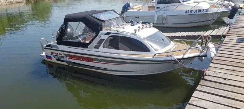 Катер гризли 580 крузер. Grizzly 660 катер. Катер grizzly 580 cruiser. Катера гризли бу. Катер grizzly g680 pro.
