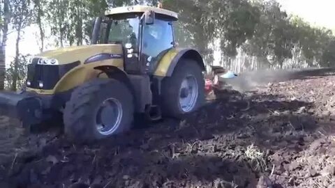 Трактора видео плуги