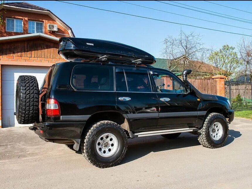 Ленд крузер 100 4.2 дизель расход. Toyota land cruiser 105 аккумулятор. лэнд крузер 2005 с внедорожным обвесом. история черныша toyota land cruiser 105. тойота ленд крузер 100 4.2 дизель главное реле.