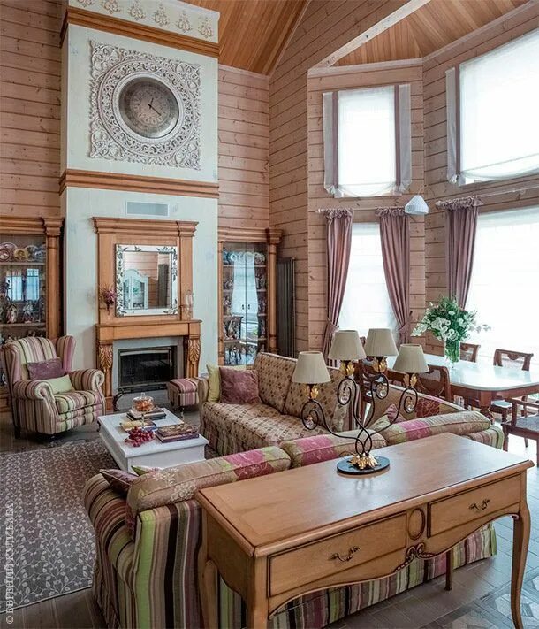 Charming shingle-style cottage sits on a knoll above Lake Minnetonka Living room