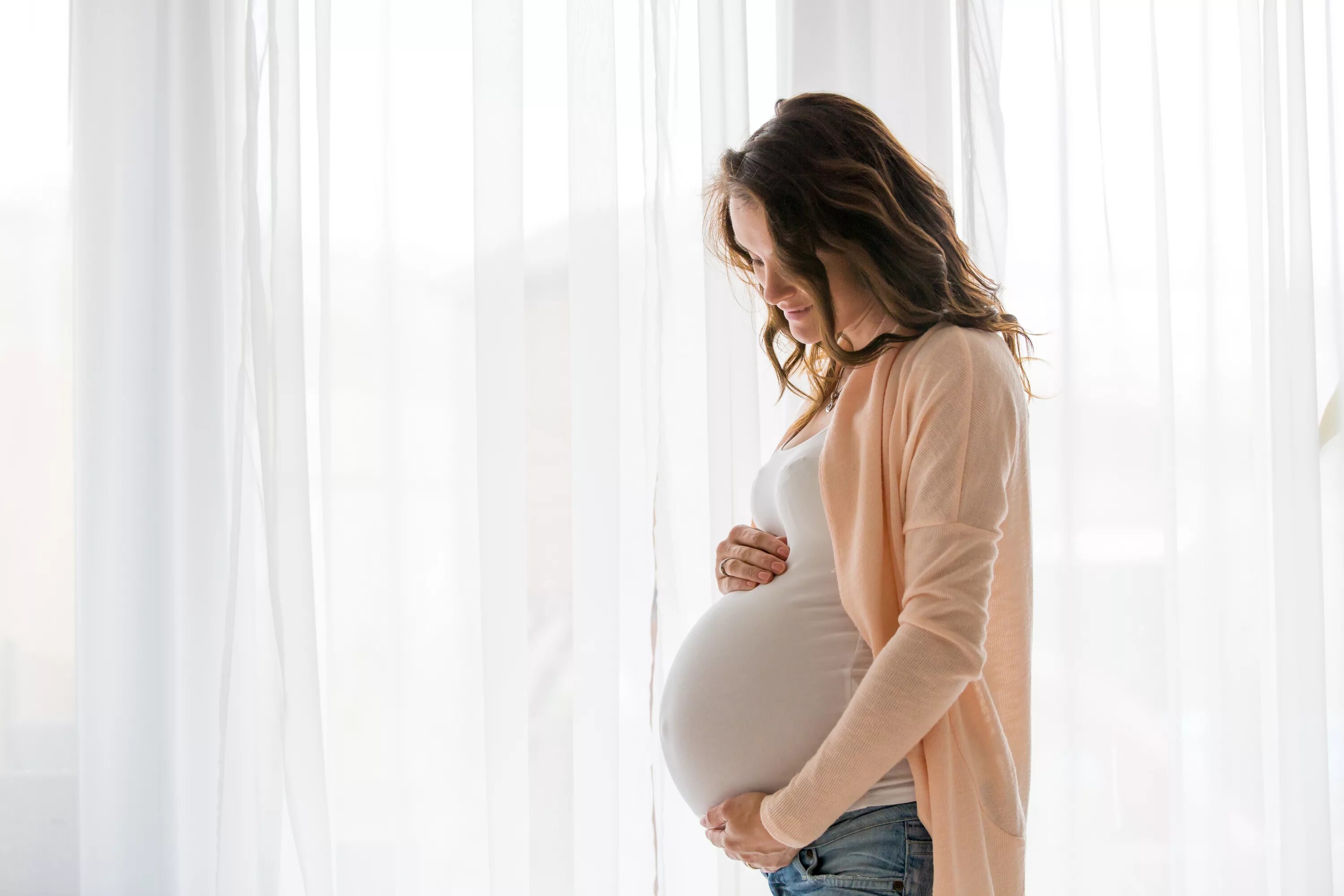 Woman is pregnant. Беременные девушки. Фото беременной девушки.