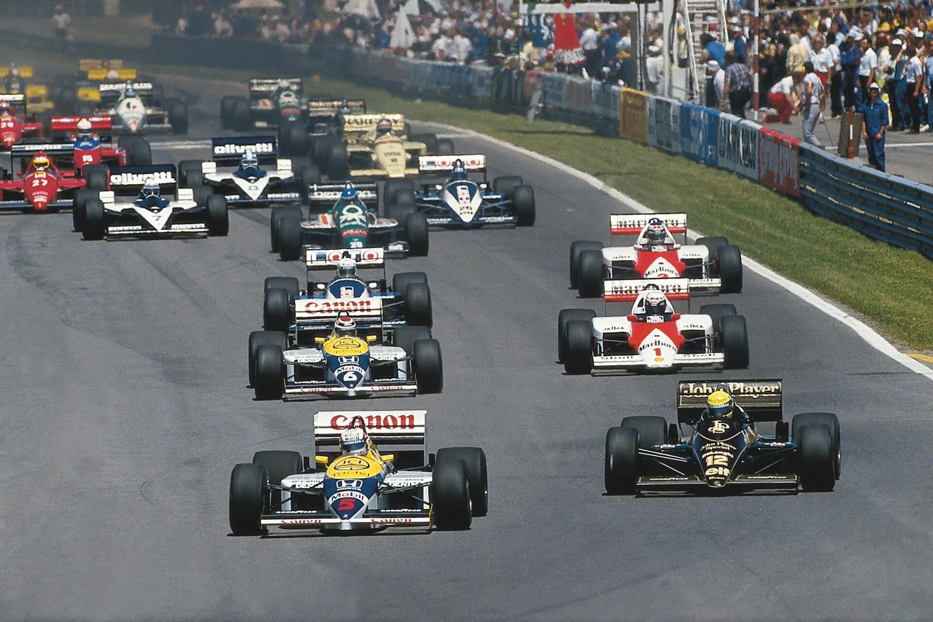 Формула 1 год основания. Айртон Сенна ф1 1991. Болиды ф1 1988. Болиды ф1 1980. Lotus f1 1992.