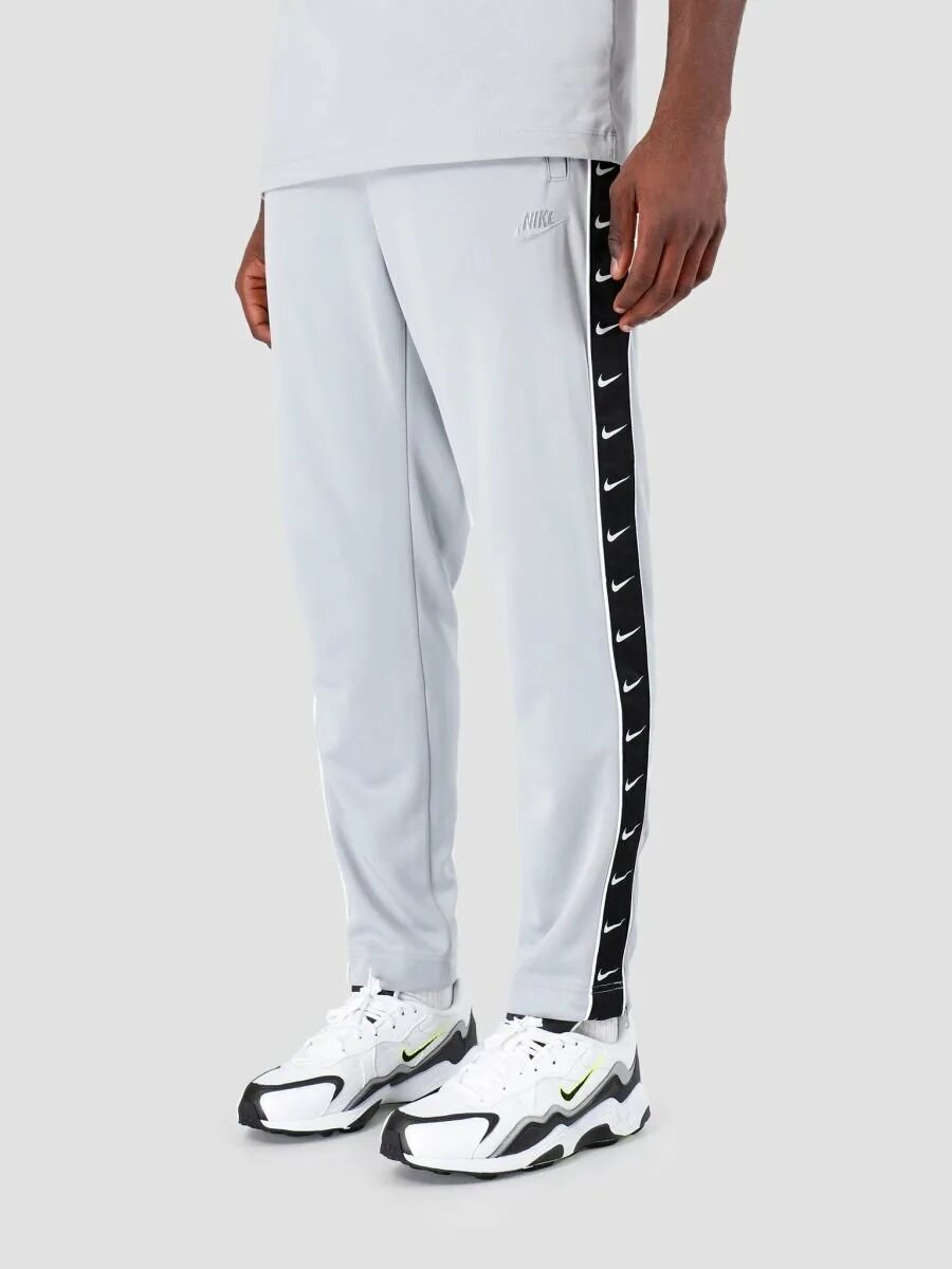 Широкие штаны вб. Nike ar3142. Дрилл штаны Nike. Штаны Nike x Skepta track Pant. Мужские брюки Nike Sportswear track Pants.