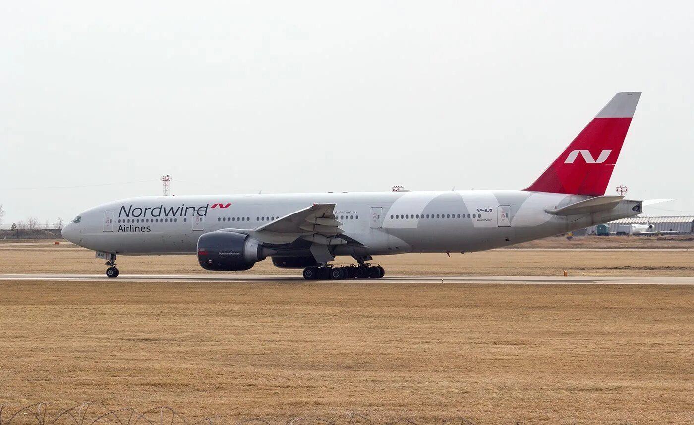 Северный ветер б. Боинг 777 200 Норд Винд. Nordwind Airlines Боинг 777. Boeing 777-200er Норд Винд. B777-200er салон.