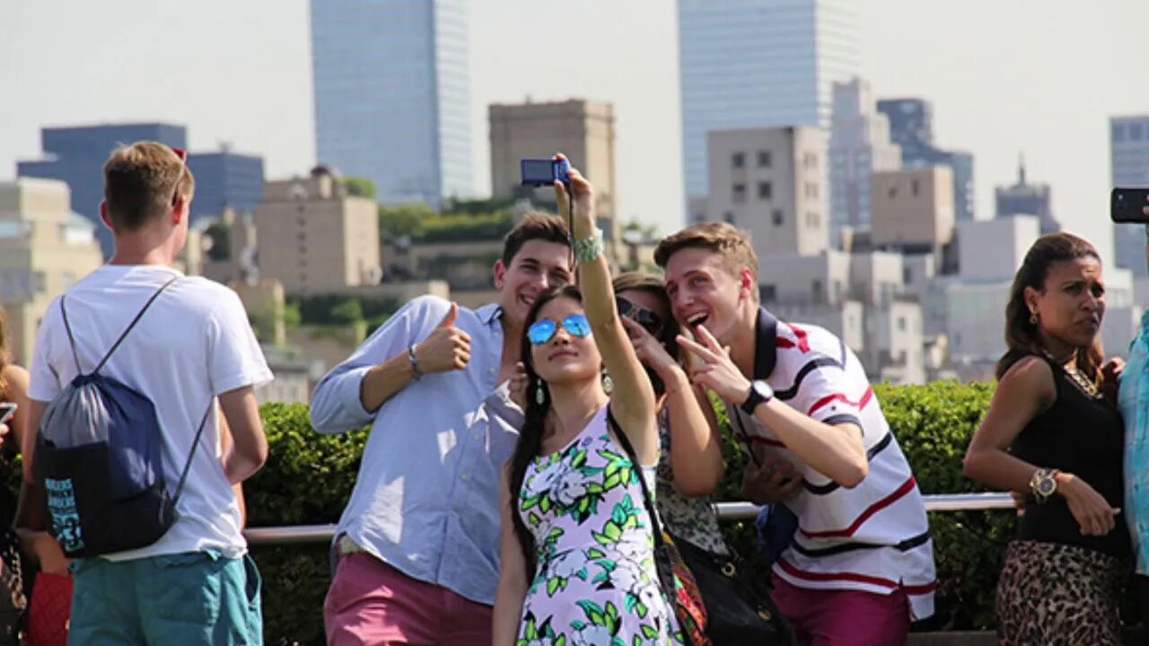 People taking selfie. People are taking selfies. People taking photos. These people 1 taking