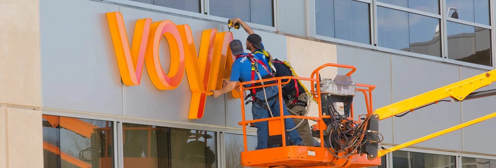 Signage installation. Sign installation. Installation of Signage on the Store. Parking lot Lighting.