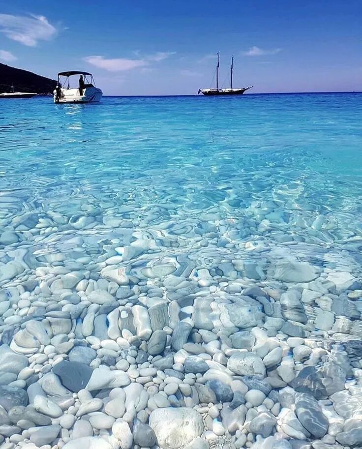Download Rocky Crystal Beach Waters Background Wallpapers.com