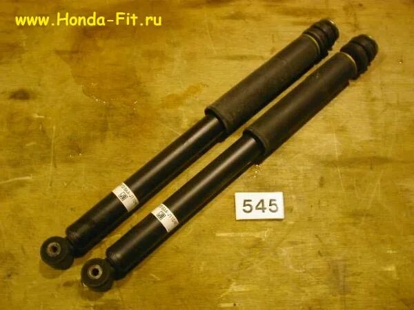 Амортизатор задний фит. Задние амортизаторы хонда фит 2002. амортизатор задний хонда фит ария. амортизаторы honda fit. хонда фит стойка амортизатора задний.