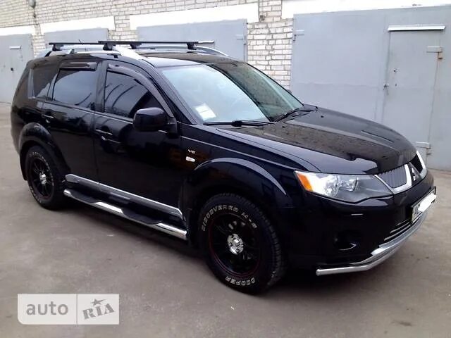 Mitsubishi outlander резина. Мицубиси Аутлендер 2008 на грязевой резине. Mitsubishi Outlander XL на грязевой резине. Outlander XL 2009 большая резина. Митсубиси Аутлендер на грязевой резине.