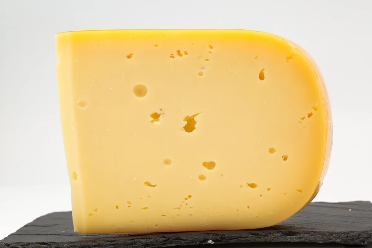 Лучший сыр гауда. Голландский сыр гауда. сыр gouda gouda. сыр cheddar gauda. сыр гауда твердый.