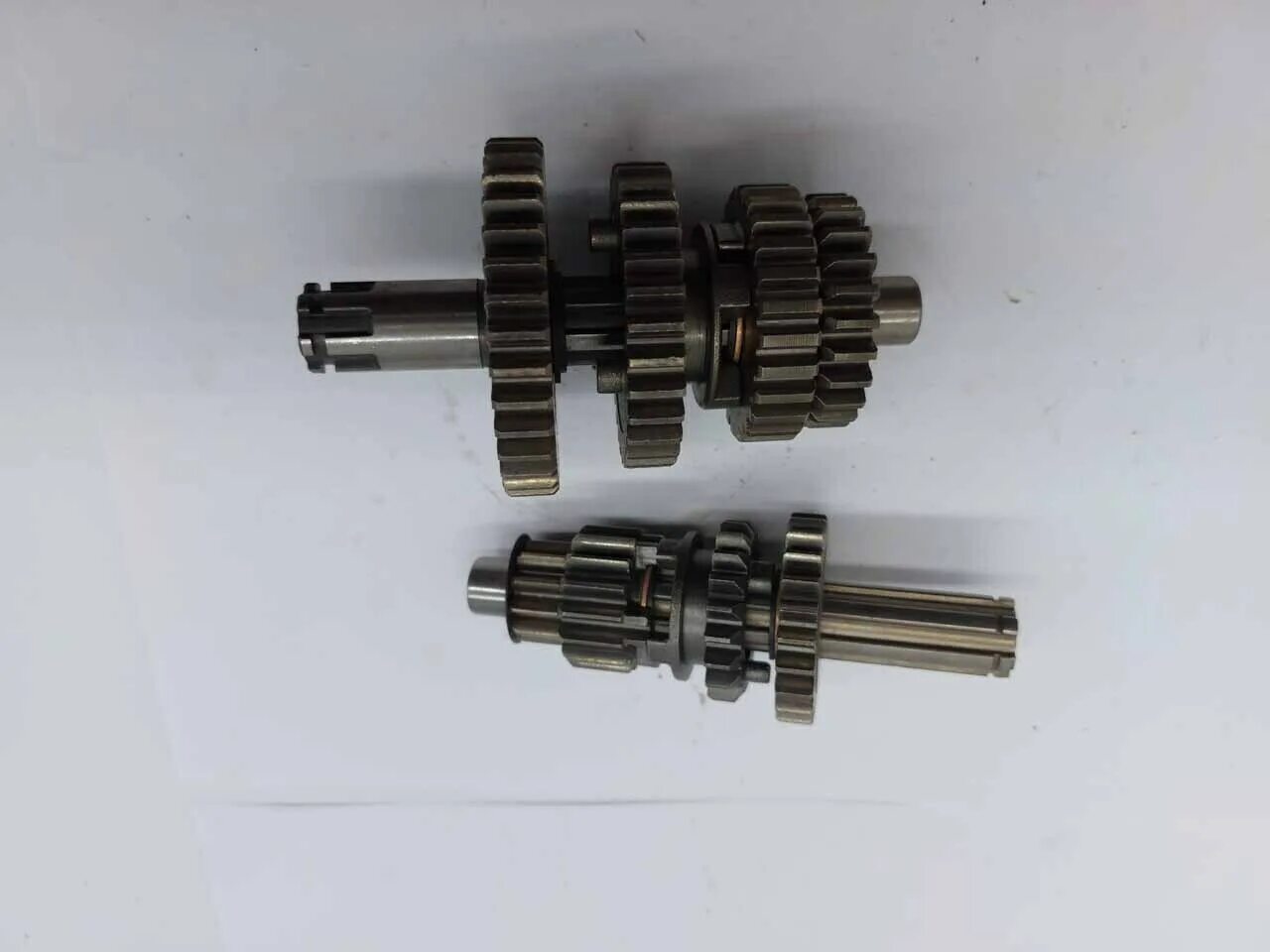 Шестерня главной передачи мопед альфа 110 кубов. Коробка передач на мопед альфа. Валы кпп 139fmb. Коробка альфа 110. Коробка передач мопед альфа 110.