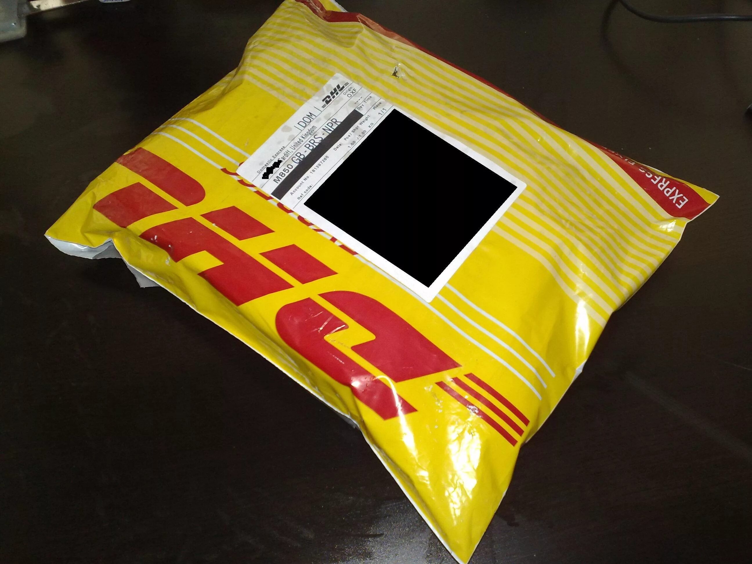 Package has arrived. Пакет DHL. Мешок DHL. DHL упаковка. Посылки DHL.