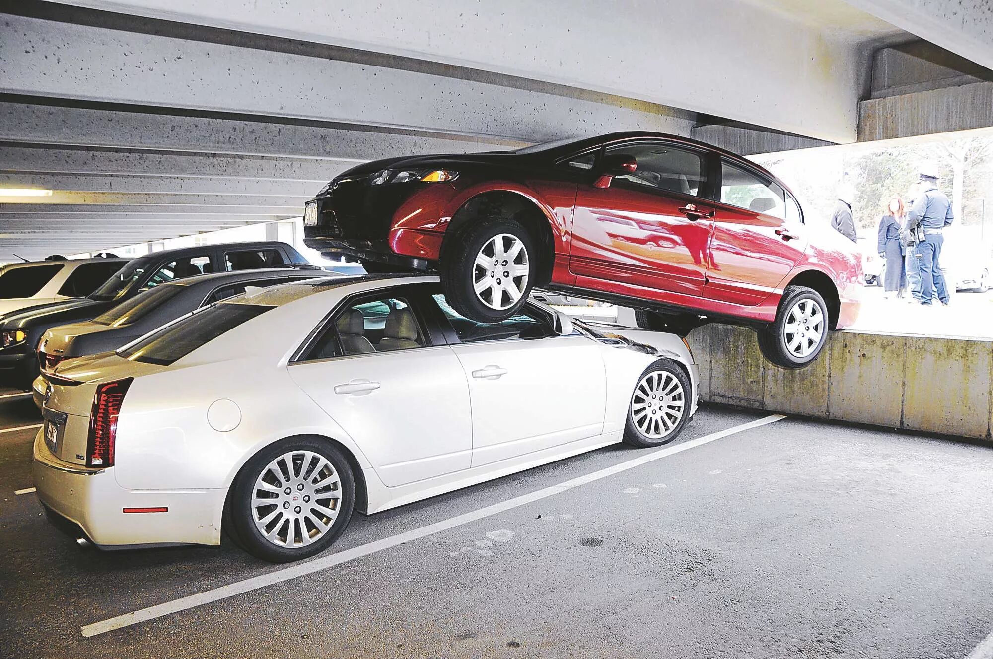 Go get car. Crash garage. a few cars on the parking. the end cars. illegal mass parking.