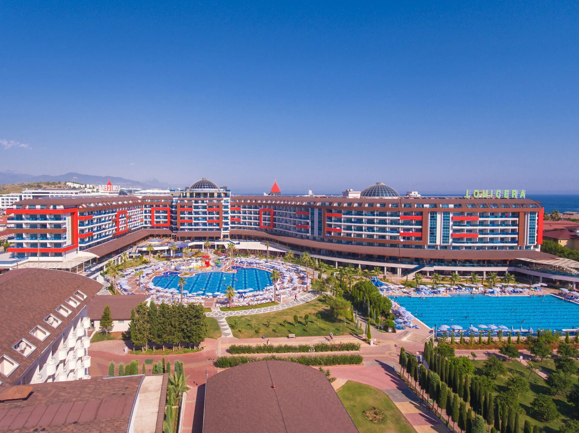 Lonicera world resort hotel. Лонисера Резорт спа 5 Турция. Турция отель Lonicera Resort Spa 5. Отель лонисера Турция 5. Анталия Алания лонисера.