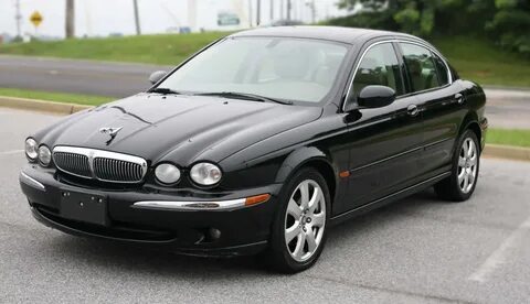 Download Sleek Jaguar X-type on an open road Wallpaper | Wallpapers.com 