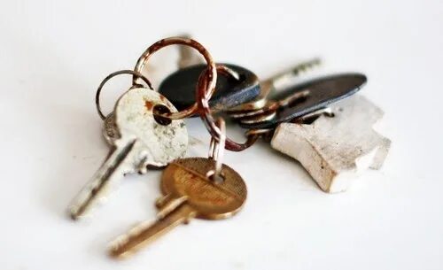 Where was were your keys. Keys on the table. a silver key on the table. the keys are on the table. where are my keys.