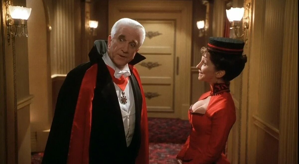 Лесли нильсен дракула. Лесли нильсен вампир. Лесли нильсен дракула. Дракула мёртвый и довольный фильм 1995. Дракула фильм лесли нильсен.