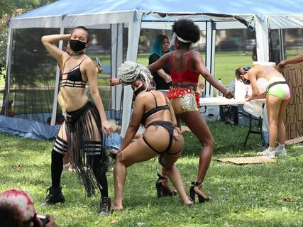 Half-naked strippers dance on poles in a PARK in pandemic 'protest' sparking fur