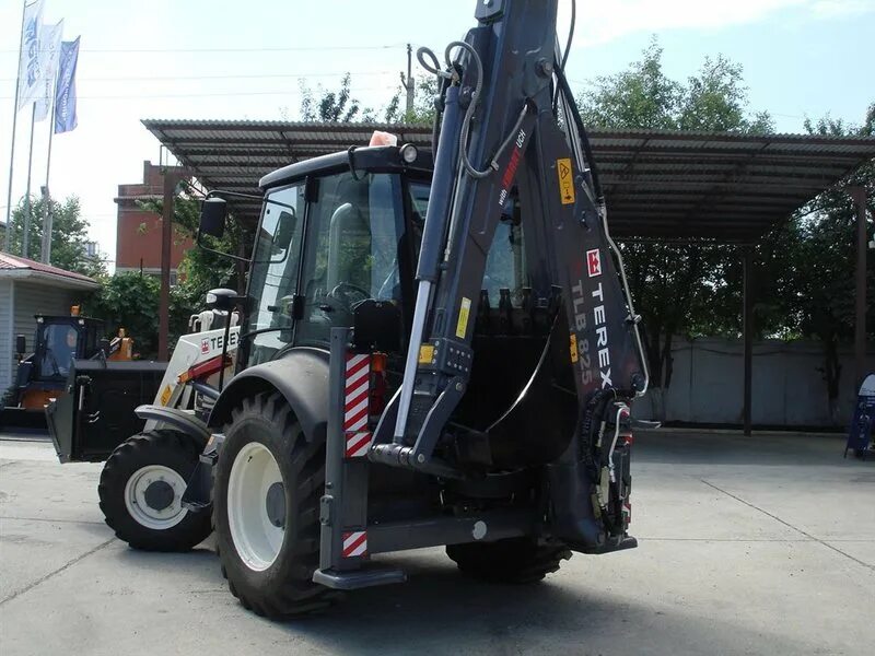 Экскаватор погрузчик 825. Terex-825-RM. Terex TLB 825. TLB 825-RM экскаватор-погрузчик. TLB 825-RM кабина.