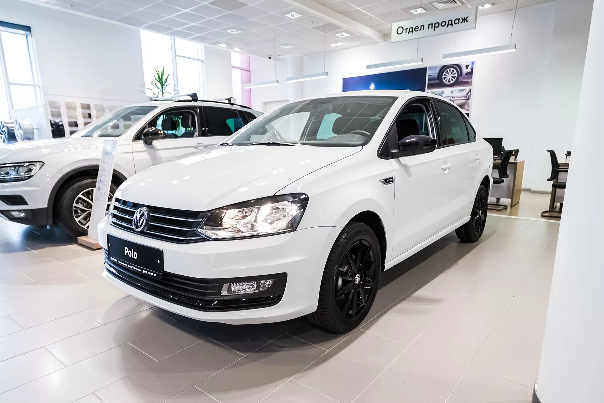 Купить фольксваген брянск и область. Polo sedan 2015 белый. Фольксваген поло в автосалоне. Volkswagen Polo respect. Фольксваген поло оф дилер.