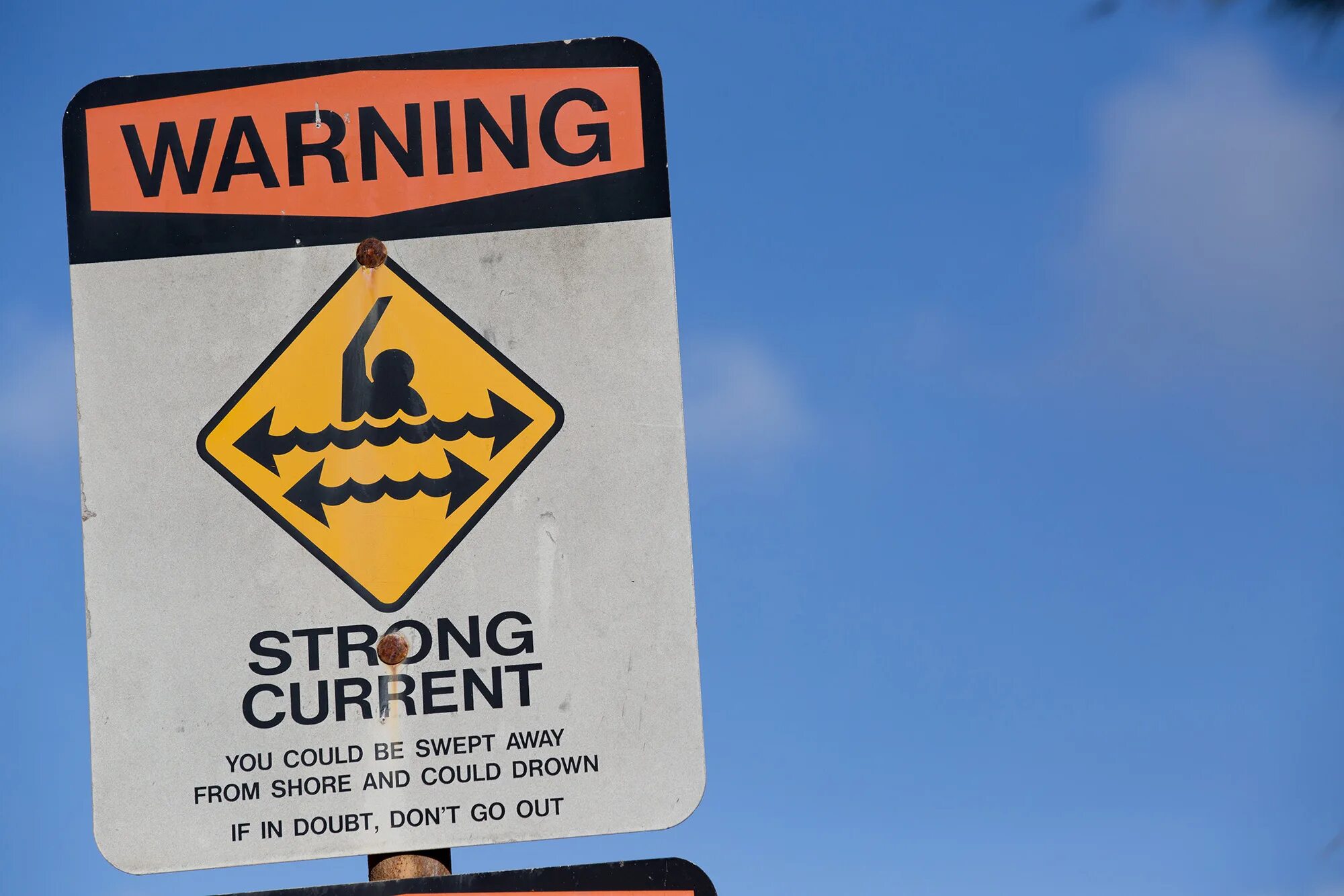 Current warning. Strong current. caution beach is not play.