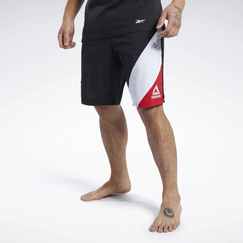 Шорты reebok мужские. Шорты юфс рибок. Шорты Reebok UFC FG Capsule Shor. Шорты рибок UFC. Спортивные шорты мужские Reebok UFC.