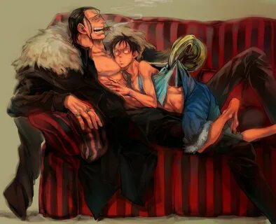 two people sitting on a couch with one holding the other 