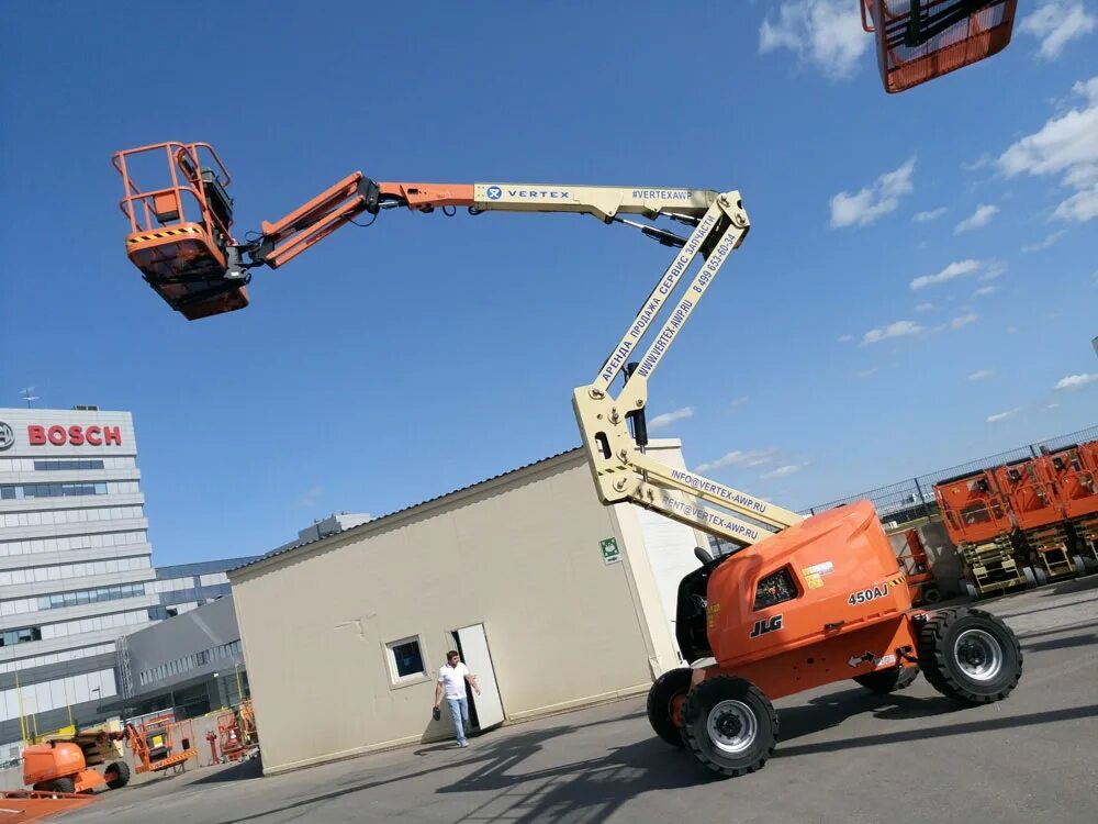 Аренда коленчатого подъемника аренда строй. JLG 450aj. Подъемник JLG 450 AJ. Коленчатый подъемник JLG 450 A. Подъемник JLG 800aj.