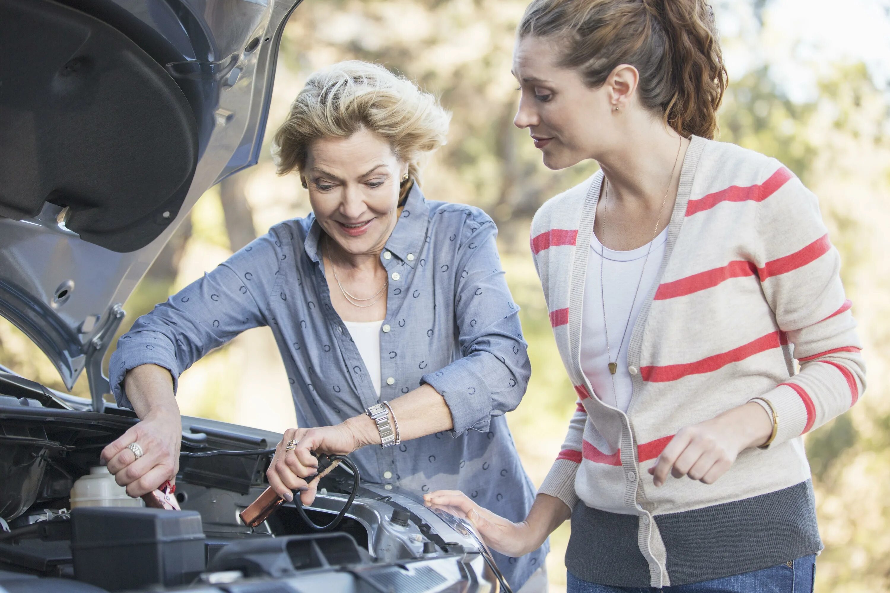 Jump started. Car start. car jump. two people talking in car. car hold on.