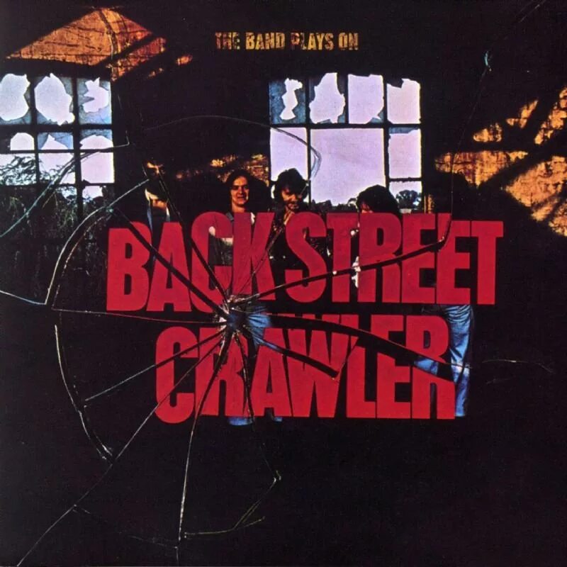 Back street crawler. A man standing in the street. Funeral dress. Back to street. Back on the street.