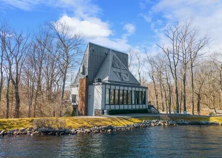 Listed: A waterfront Easton home with a gigantic water wheel in the floor -...