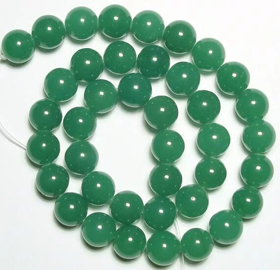 Кварц авантюрин зеленый. Green aventurine камень. Зеленый авантюрин или кварц. Кварц авантюрин зеленый. Камень талисман авантюрин.