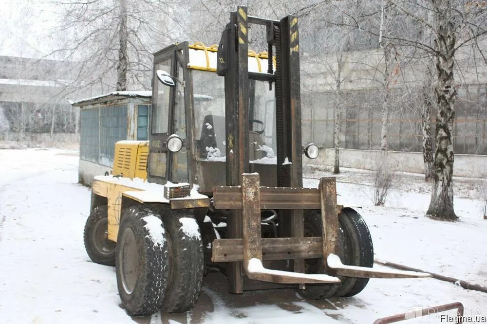 Автопогрузчик 41030мф. Автопогрузчик ЛЗА-41030. Погрузчик Lev 41030. Автопогрузчик вилочный колесный 41030 Лев.