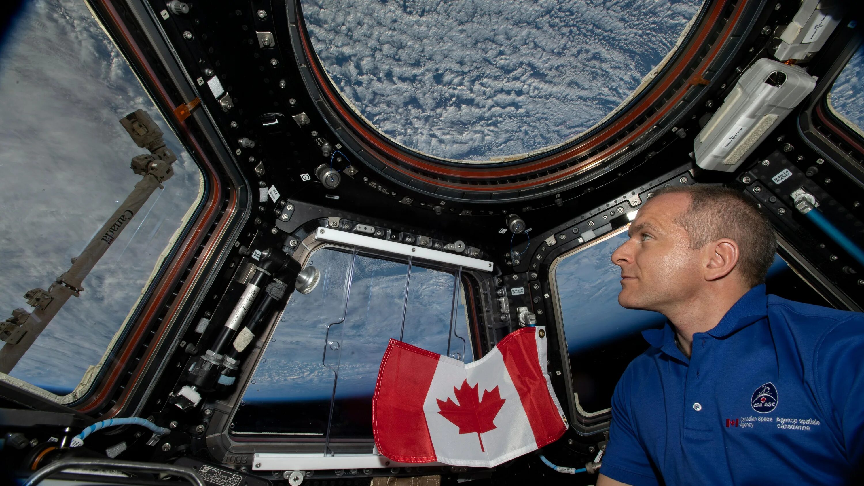 Канадский космонавт. Канада с космоса. Международное сотрудничество в космосе. Космонавты из Канады.