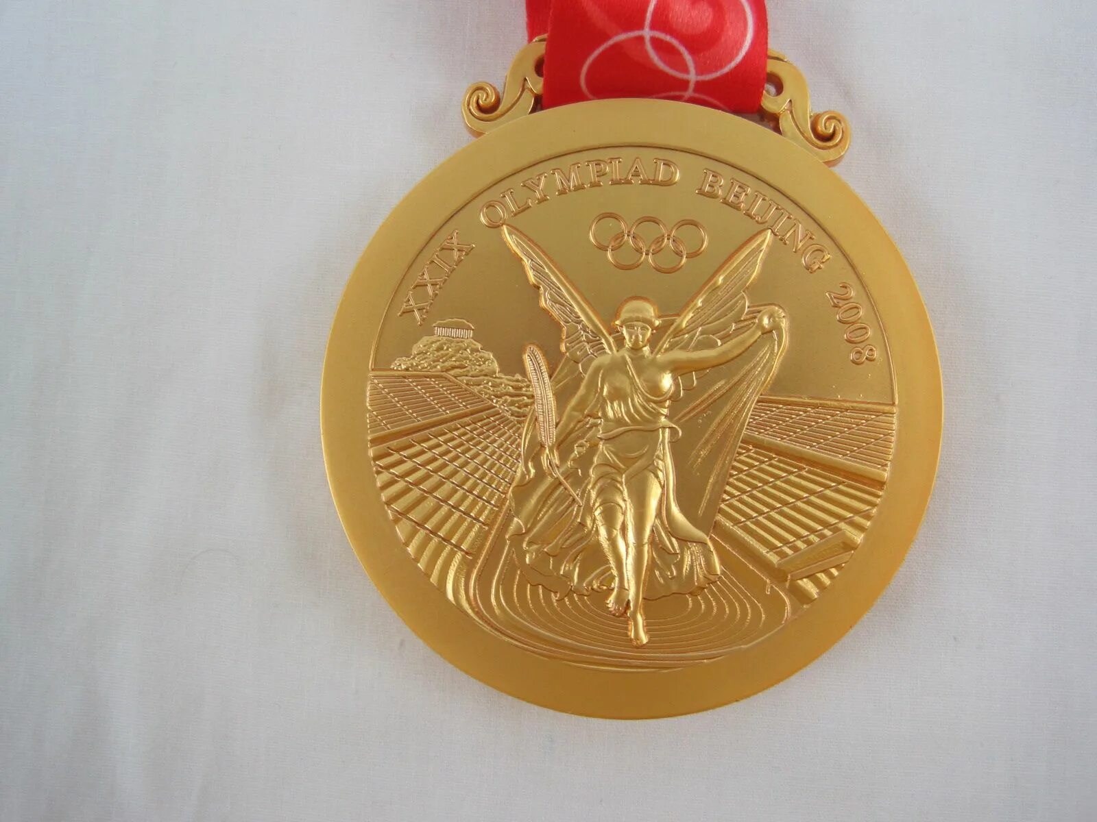 Olympic gold medal. Золотая Олимпийская медаль 2008. Олимпийская медаль Пекин 2008. Золотая Олимпийская медаль Пекин 2008.