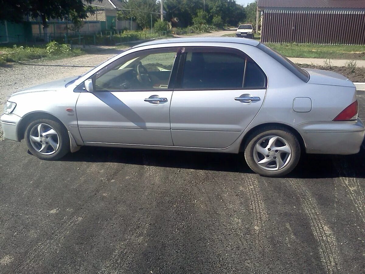 Mitsubishi lancer 2001. Митсубиси Лансер 2001. Митсубиси Лансер 2001г. Лансер цедия 2001.