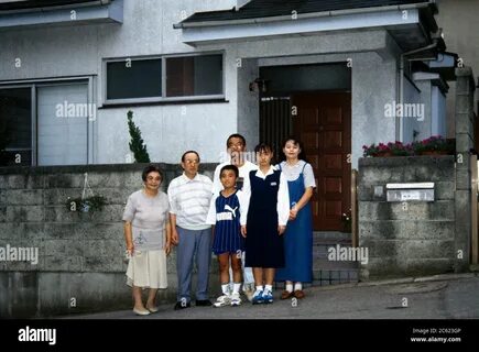 Tokyo Japan Portrait of Family Standing outside their home Stock Photo - Al...