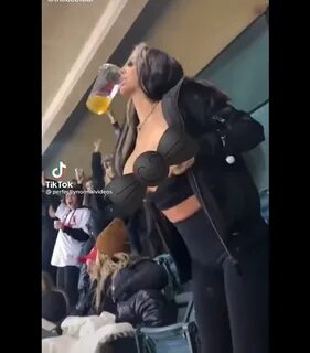 Woman flashing at sporting events.