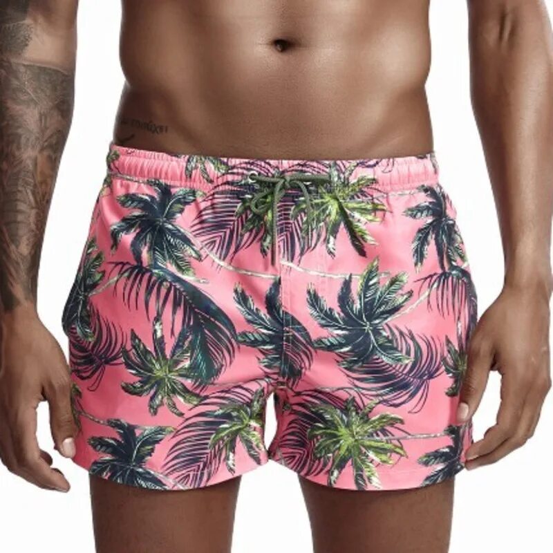 Розовые мужские шорты. Шорты с пальмами мужские. Гавайские шорты. Гавайские шорты мужские. Пляжные шорты с пальмами.